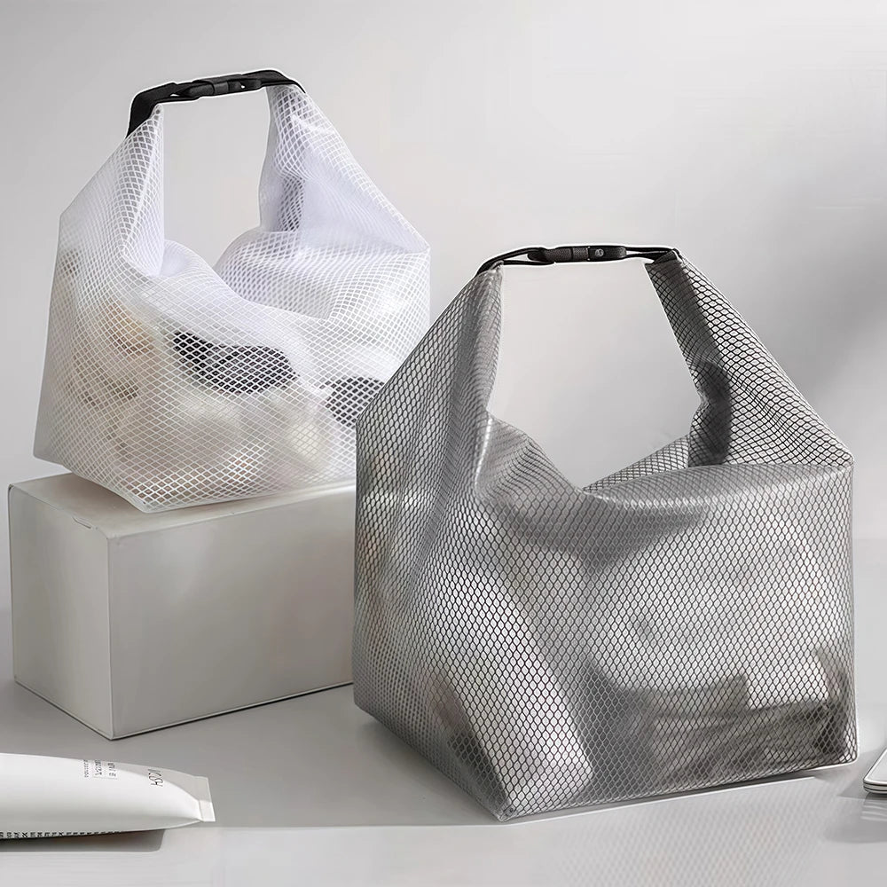 Two mesh shopping bags on a light gray background